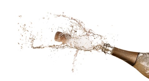 Sparkling wine splashing out of bottle on white background