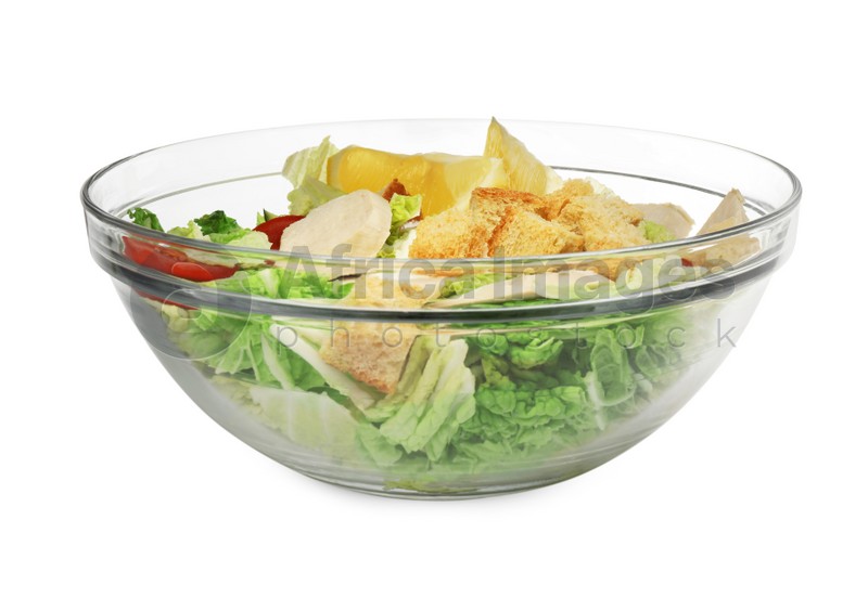 Bowl of delicious salad with Chinese cabbage, meat and bread croutons isolated on white