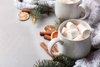 Composition with hot cocoa drink on grey background
