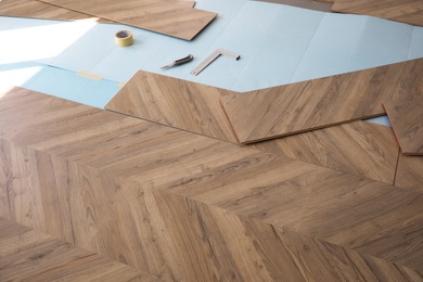Installation of laminated wooden floor at home