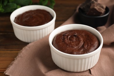 Delicious fresh chocolate fondant on wooden table, closeup