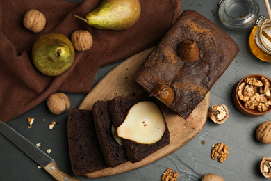 Flat lay composition with tasty pear bread on black table. Homemade cake