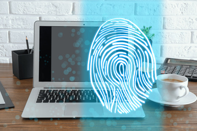 Fingerprint identification. Modern laptop on table indoors