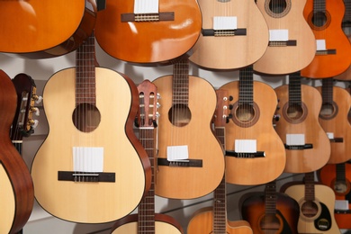 Rows of different guitars in music store