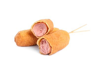 Delicious deep fried corn dogs on white background