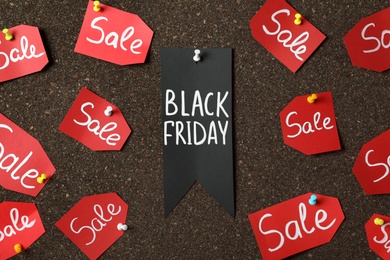 Tags with phrase Black Friday and Sale on dark cork board