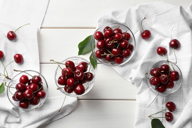 Sweet red cherries on white wooden table, flat lay