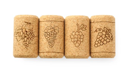 Wine corks with grape images on white background, top view