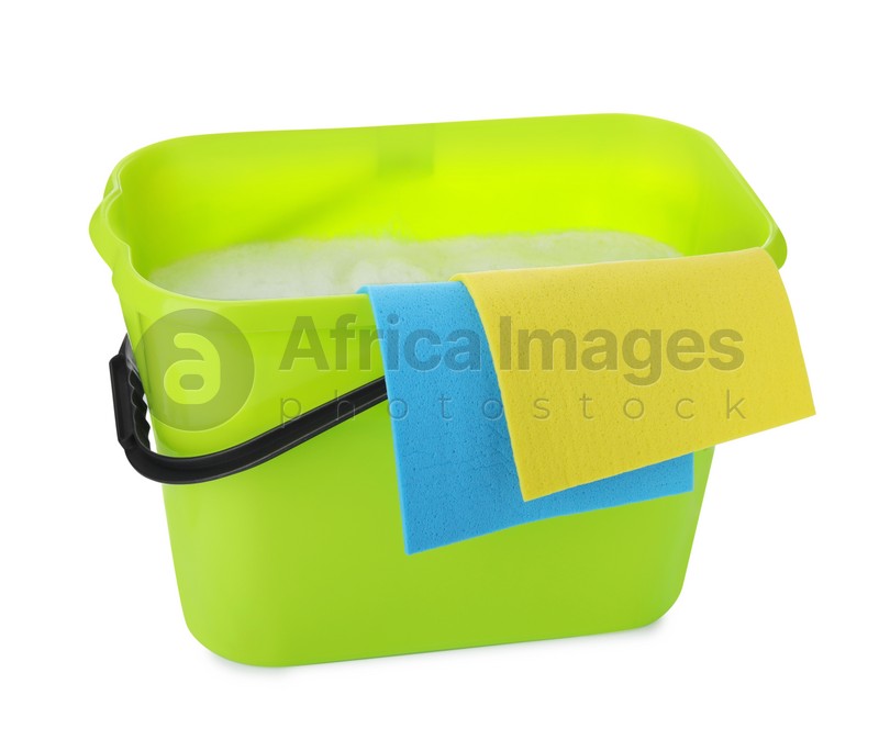 Green bucket with rags isolated on white