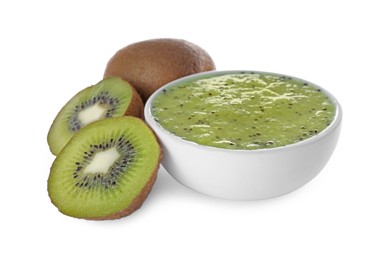 Kiwi puree in bowl and fresh fruits on white background
