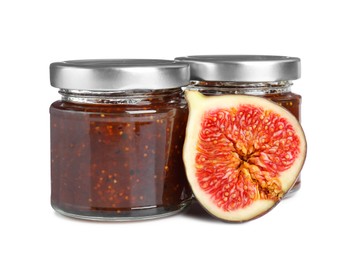 Glass jars of tasty sweet fig jam isolated on white