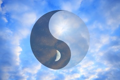 Ying Yang symbol against blue sky. Feng Shui philosophy