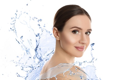Beautiful young woman and splashing water on white background. Spa portrait