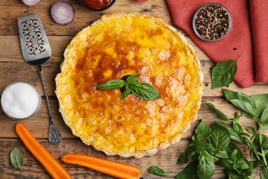 Delicious pie with minced meat on wooden table, flat lay