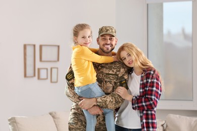 Soldier in Ukrainian military uniform reunited with his family at home