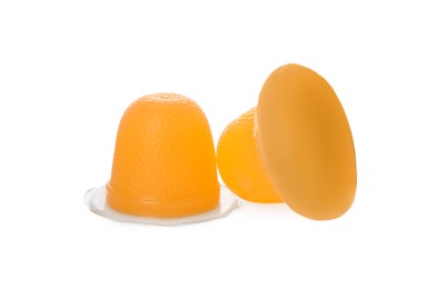 Delicious orange jelly cups on white background