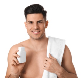 Handsome man with stubble holding post shave lotion on white background
