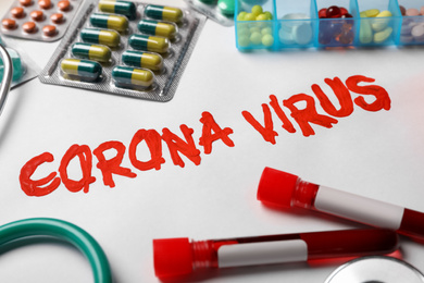 Phrase CORONA VIRUS and medicines on white background
