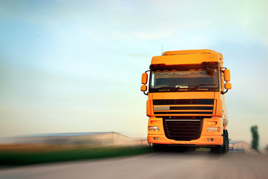 Image of Logistics concept. Truck on country road, motion blur effect 