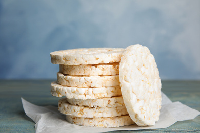 Stack of crunchy rice cakes on wooden table