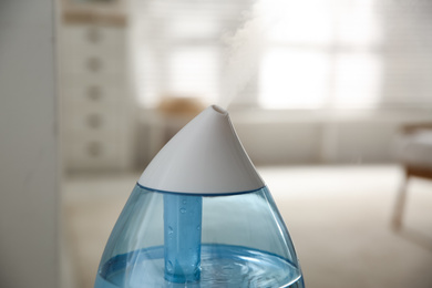 Modern humidifier indoors, closeup view. Home appliance