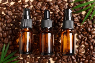 Flat lay composition with bottles of organic cosmetic products and coffee beans on beige background