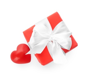 Beautiful gift box and red heart on white background, top view. Valentine's day celebration