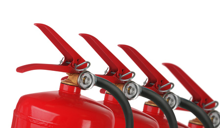 Set with fire extinguishers on white background 