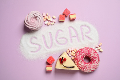 Flat lay composition with sweets and word SUGAR on lilac background