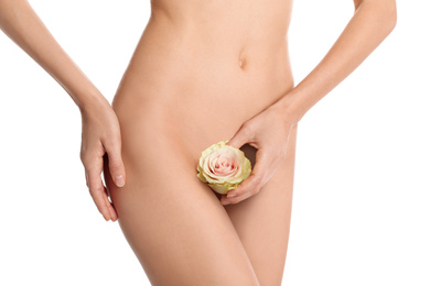 Woman with flower showing smooth skin after Brazilian bikini epilation on white background, closeup. Body care concept