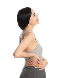 Woman suffering from lower back pain on white background. Visiting orthopedist