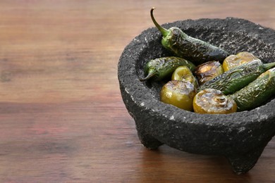 Photo of Different ingredients for cooking tasty salsa sauce on wooden table, closeup. Space for text