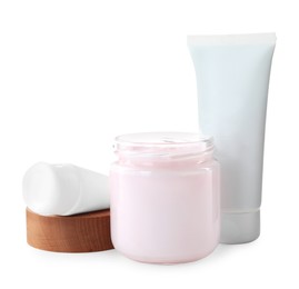 Jar and tubes of hand cream on white background
