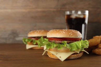 Photo of Delicious fast food menu on wooden table