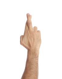 Man with crossed fingers on white background, closeup. Superstition concept