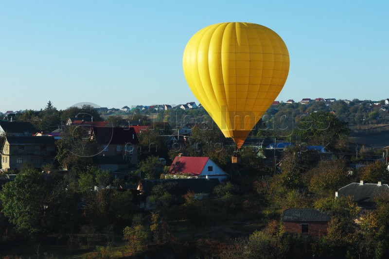 Beautiful view of hot air balloon flying over countryside