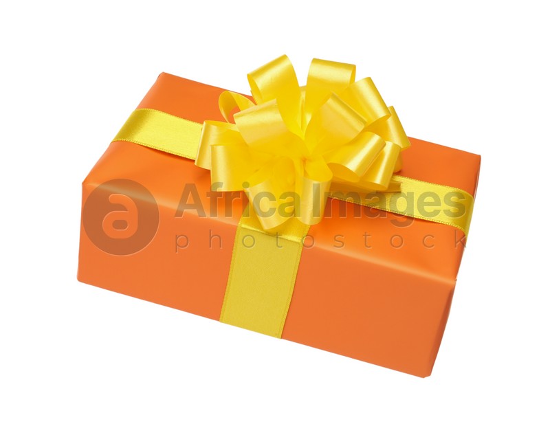 Orange gift box with yellow bow isolated on white