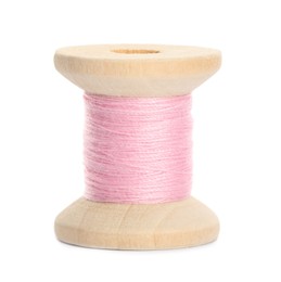 Wooden spool of pink sewing thread isolated on white