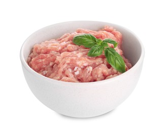 Raw chicken minced meat with basil in bowl on white background