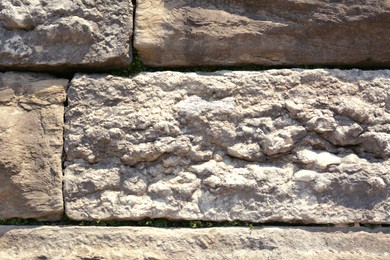 Texture of old stone wall as background, closeup