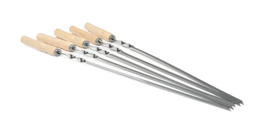Metal skewers with wooden handle on white background