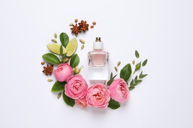 Flat lay composition with bottle of perfume, lime and beautiful flowers on white background