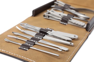 Photo of Manicure set in case on white background, closeup