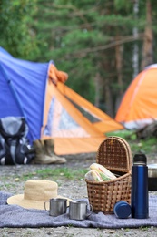 Thermos and other camping equipment outdoors on summer day 