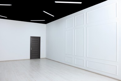 Photo of Beautiful walls and wooden door in spacious room during repair