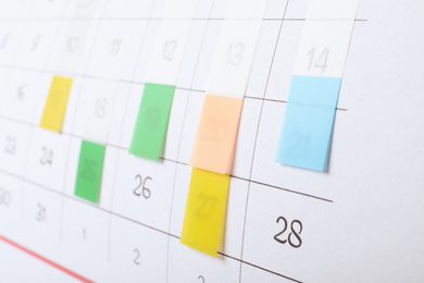 Calendar page with colorful stickers, closeup view