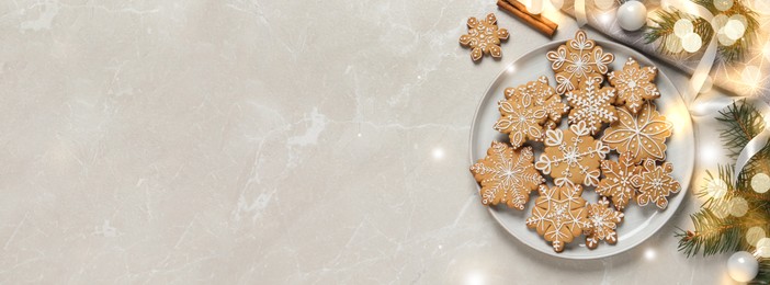 Tasty Christmas cookies and festive decor on light grey marble table, flat lay with space for text. Horizontal banner design