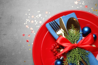 Photo of Beautiful Christmas table setting on grey background, top view