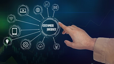 Image of Customer journey concept. Man pointing at virtual screen with different icons on dark background, closeup