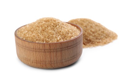 Wooden bowl with brown sugar on white background